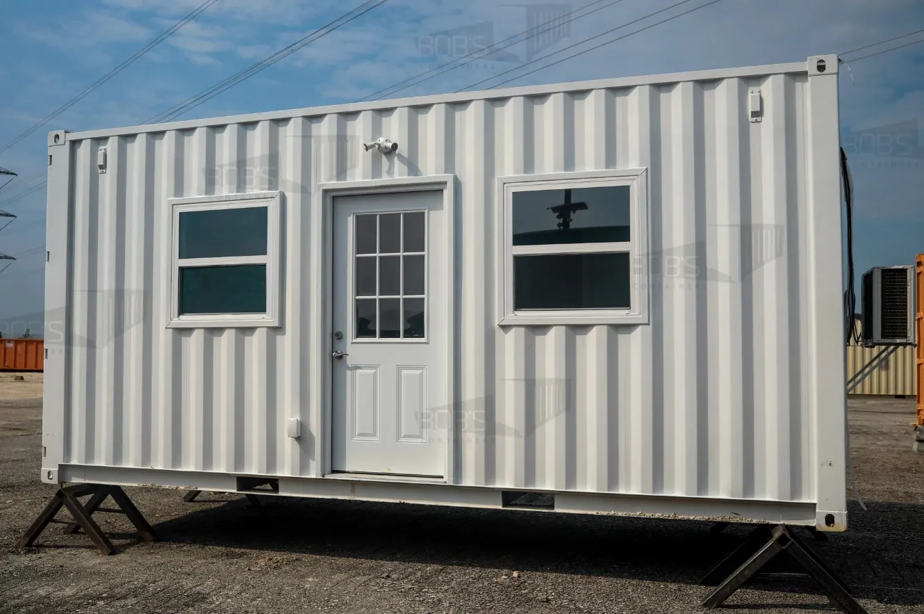 Modern white container home with elevated second level